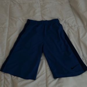 Blue Nike dri-fit shorts.